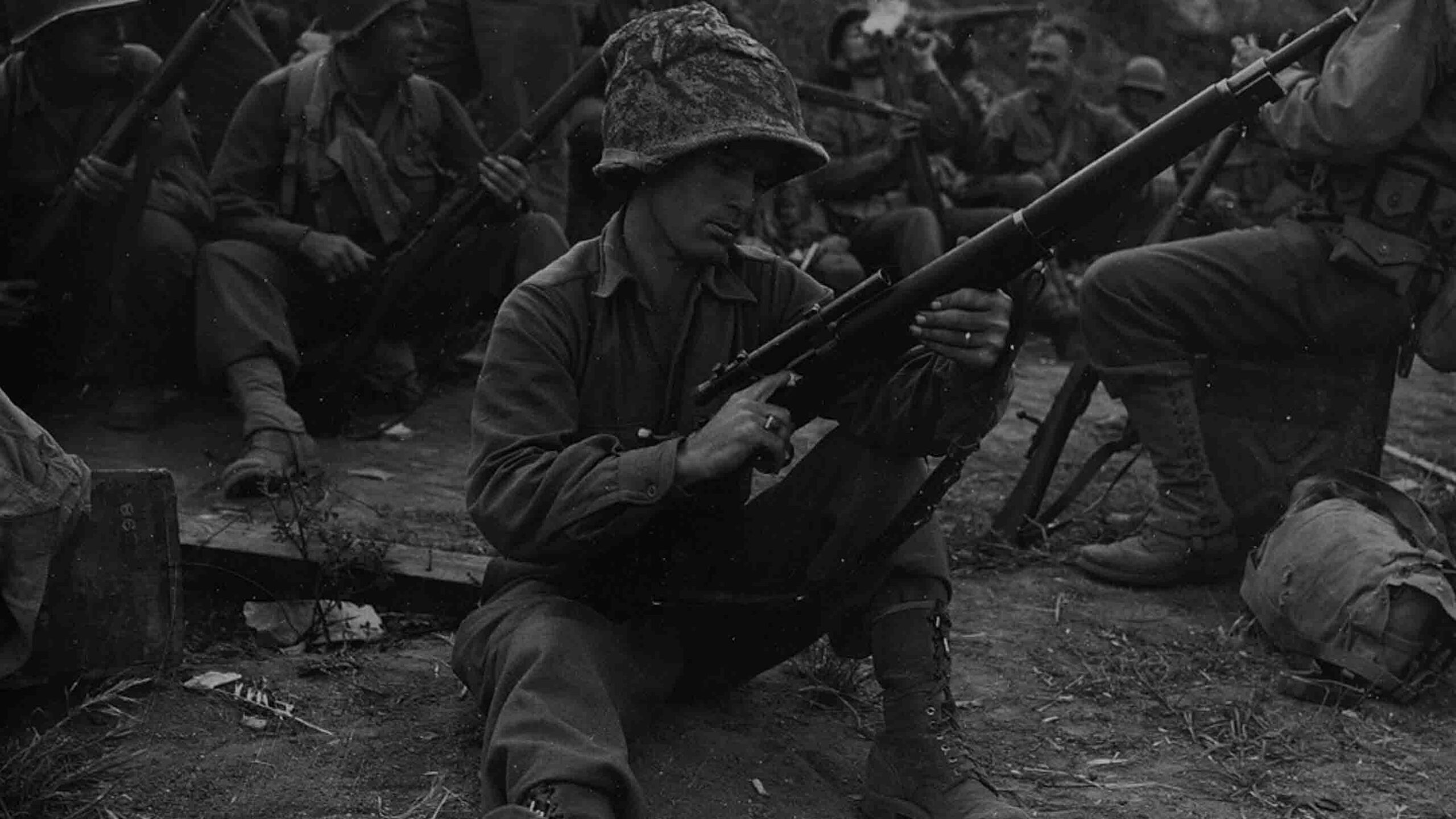 US Soldier inspects his rifle.