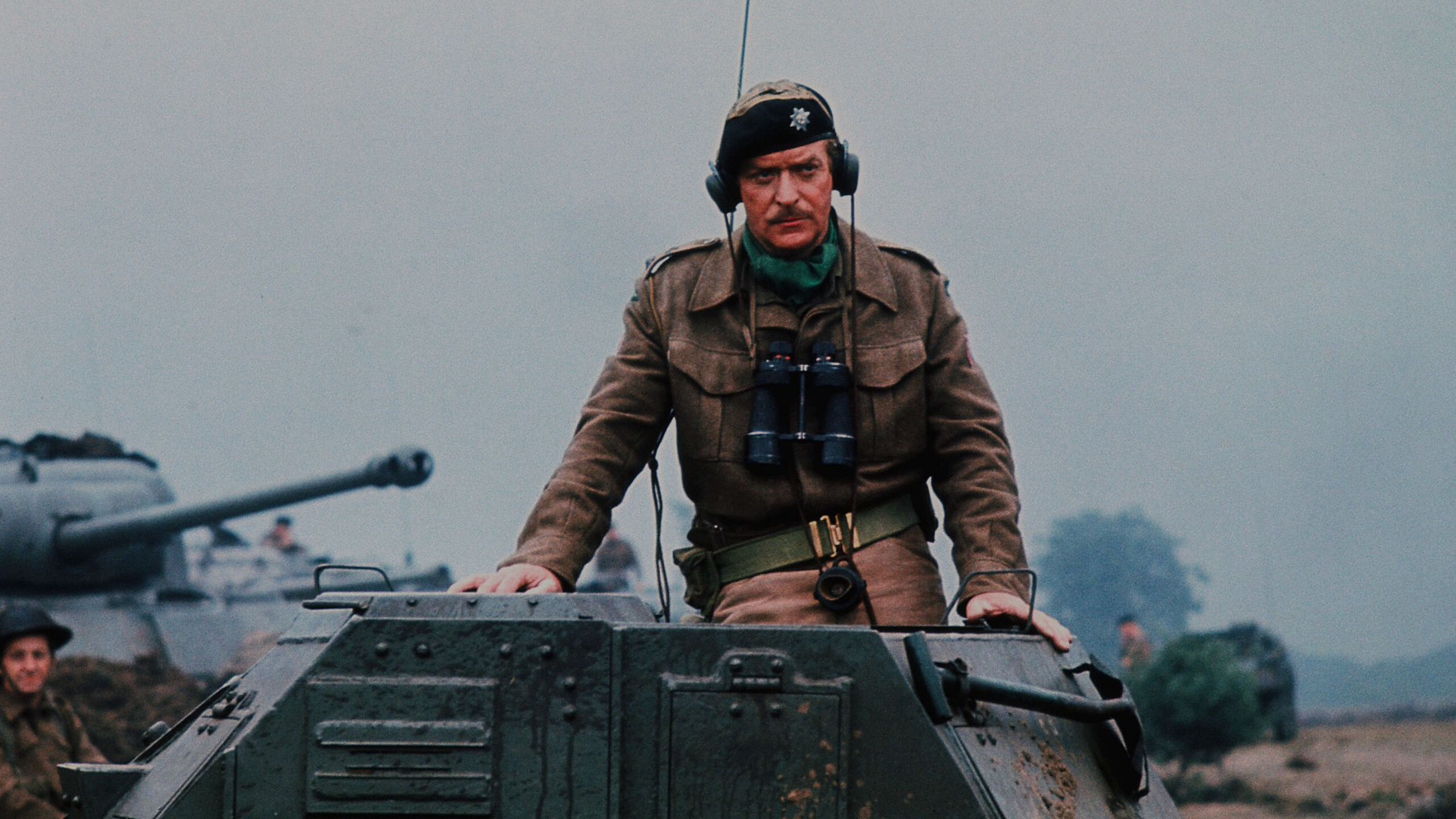 A film still from A Bridge Too Far (1977) featuring Michael Caine as Lieutenant Colonel J.O.E. Vandeleur, commander of the Irish Guards during Operation Market Garden.
