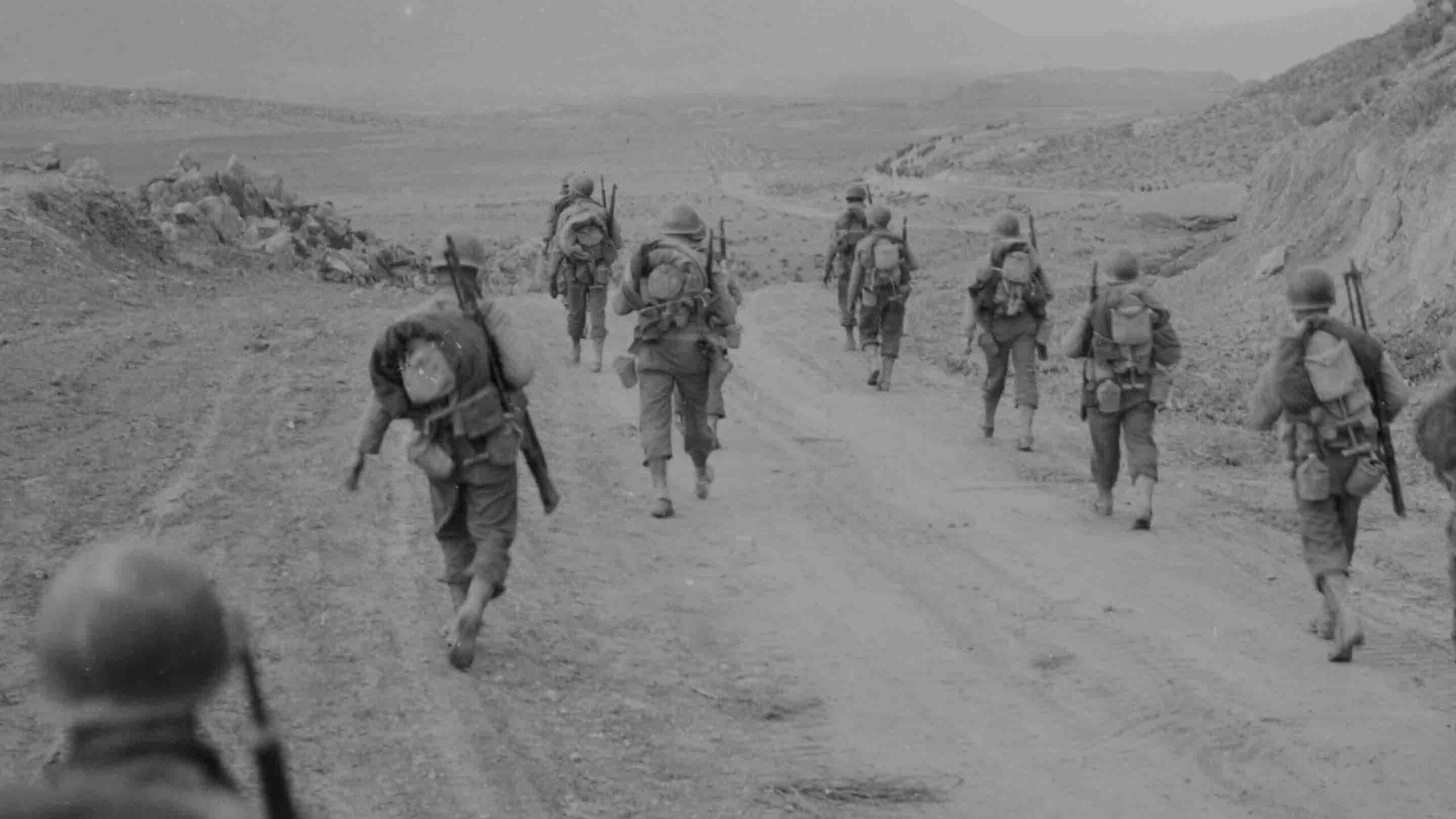 American troops moving through the Kasserine Pass.