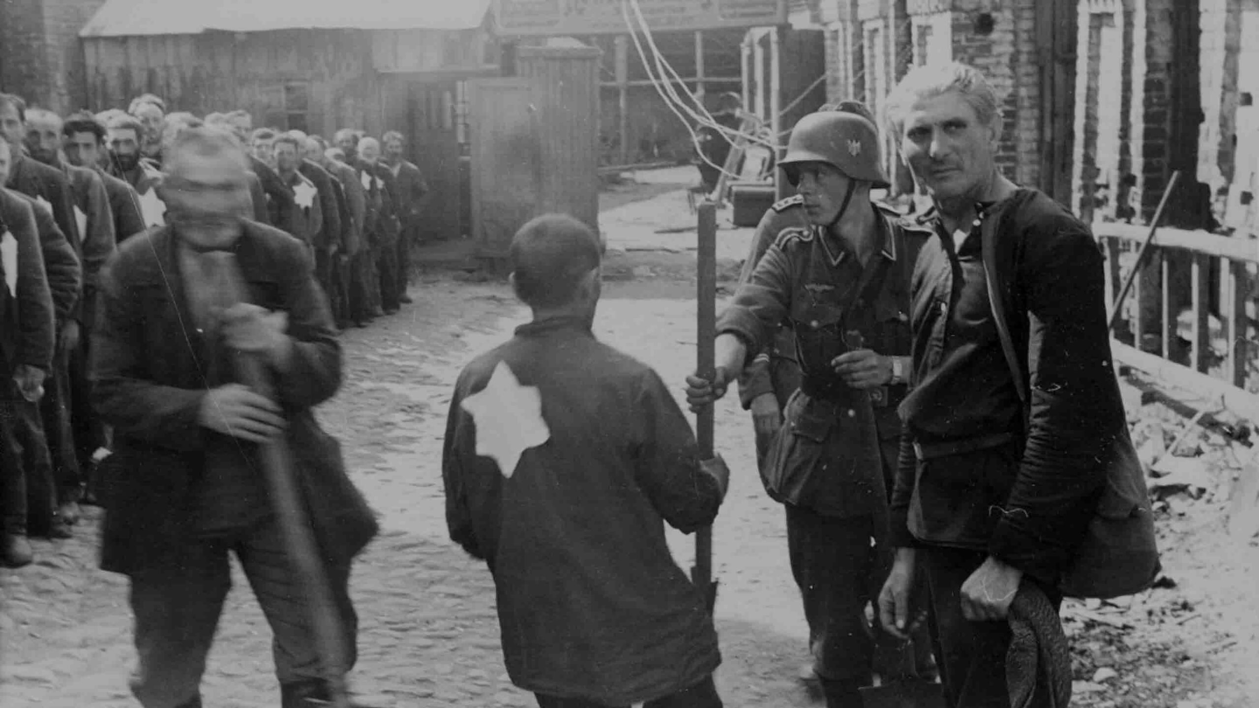 Jewish forced laborers in Mogilev, Soviet Union, July 1941, receiving shovels under Nazi occupation.