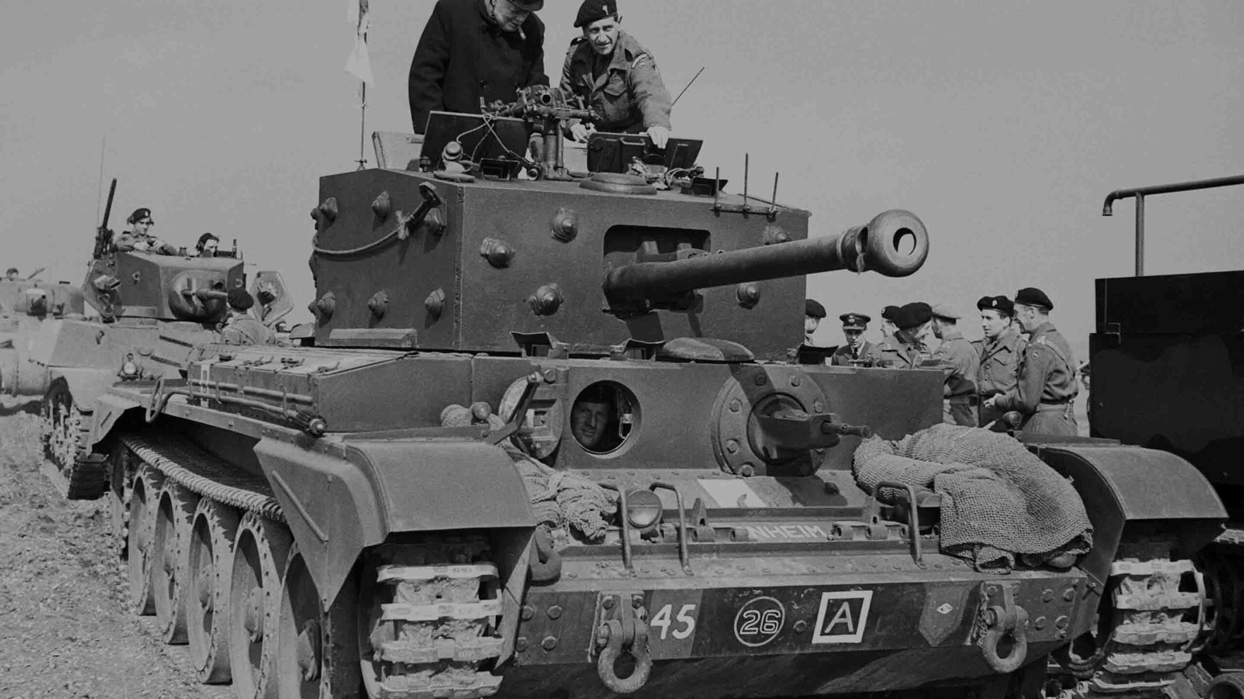 Winston Churchill inspects a Cromwell Mk IV tank, Blenheim, of No. 2 Squadron, 2nd (Armoured Reconnaissance) Battalion, Welsh Guards, at Pickering, Yorkshire, 31 March 1944.
