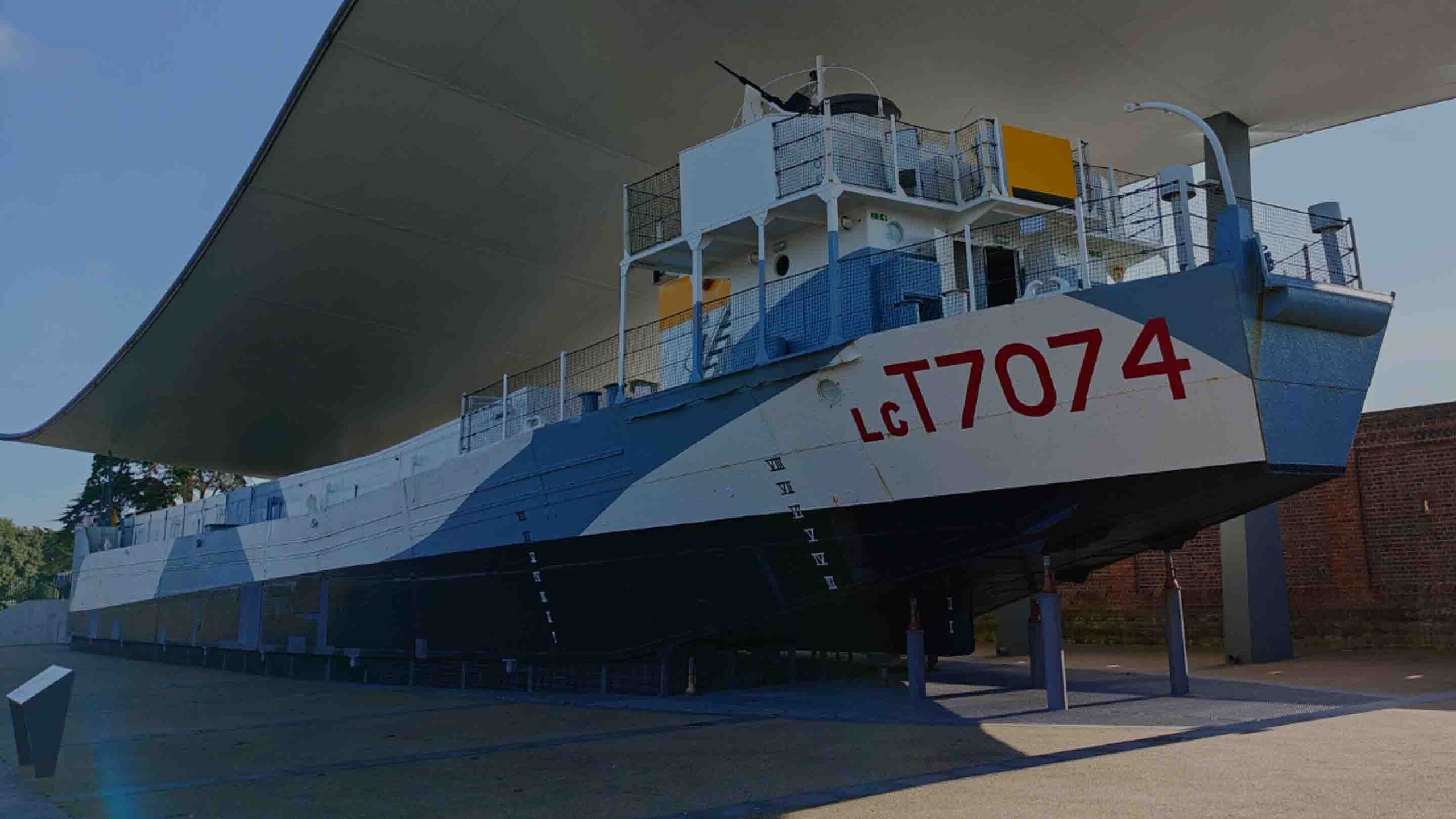 LCT 7074 at the D-Day Story Museum – A stern view of the restored Landing Craft Tank (LCT) 7074, a surviving D-Day landing craft.