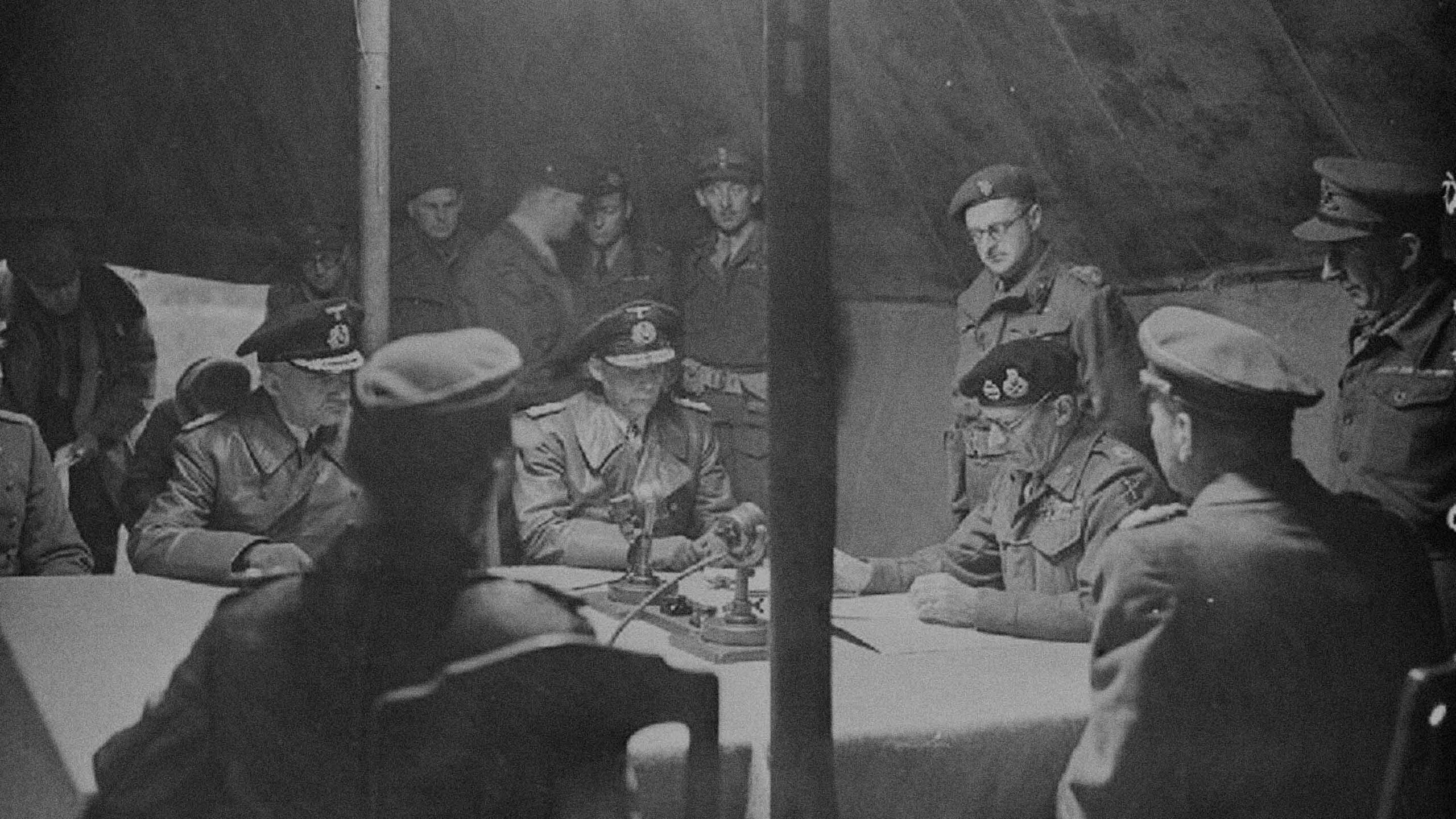 Field Marshal Bernard Montgomery signs the Instrument of Surrender of German forces in the north at Lüneburg Heath.